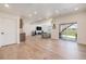 Spacious open floor plan featuring wood floors, modern lighting, and a sliding glass door at 1282 Eldorado Dr, Superior, CO 80027