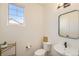 Modern powder room with a sleek mirror, stylish sink, and minimalist design perfect for guests at 1282 Eldorado Dr, Superior, CO 80027