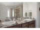 En-suite bathroom with double vanity and a large shower at 6211 Leilani Ln, Castle Rock, CO 80108