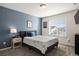 Cozy bedroom with a blue accent wall and ample closet space at 6211 Leilani Ln, Castle Rock, CO 80108