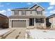 Two-story home with gray siding and a two-car garage at 6211 Leilani Ln, Castle Rock, CO 80108