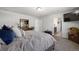 Main bedroom with king bed, en-suite bathroom access, and views at 6211 Leilani Ln, Castle Rock, CO 80108