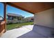 Covered patio and backyard with green lawn at 12340 Syracuse St, Thornton, CO 80602