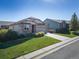 Charming home with well-maintained lawn, stone accents, and inviting curb appeal at 12340 Syracuse St, Thornton, CO 80602