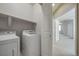 Bright laundry room with modern white washer and dryer at 12340 Syracuse St, Thornton, CO 80602