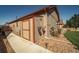 Convenient exterior shed painted in neutral tones is perfect for storing all your yard and gardening tools at 12340 Syracuse St, Thornton, CO 80602