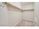 Spacious walk-in closet with carpeted floors and shelving, ready for customized organization at 12340 Syracuse St, Thornton, CO 80602