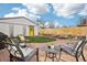 Cozy backyard space with stone patio and lawn for relaxation or entertaining at 4883 Perry St, Denver, CO 80212