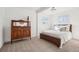 Bright bedroom with large bed, neutral carpet, and natural light from two windows at 4883 Perry St, Denver, CO 80212