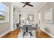 Dining room boasts hardwood floors, built-in shelving, and a stylish table creating an ideal space for entertaining at 4883 Perry St, Denver, CO 80212