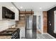Well-lit kitchen featuring stainless steel appliances, granite countertops, and unique backsplash tiles and flooring at 4883 Perry St, Denver, CO 80212