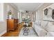 Inviting living room showcases hardwood floors, a comfortable white sofa, and chic decor for a cozy ambiance at 4883 Perry St, Denver, CO 80212