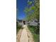 Charming single-story home with gray siding, a well-manicured lawn, and a welcoming walkway at 1925 Joliet St, Aurora, CO 80010