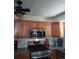 Well-equipped kitchen with stainless steel appliances, light wood cabinetry, and modern subway tile backsplash at 1925 Joliet St, Aurora, CO 80010