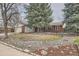 Charming brick home with a well-maintained yard and mature trees at 2056 S Newark Way, Aurora, CO 80014