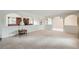 Spacious living area with neutral carpet and distinctive architectural archways at 2056 S Newark Way, Aurora, CO 80014