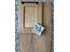 Sample of wood cabinet door, wood flooring, and a granite tile against a speckled countertop background at 4567 Westlock St, Castle Rock, CO 80104