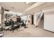 Basement featuring stairs, recreational equipment, and a large screen for entertainment at 7060 Avrum Dr, Denver, CO 80221