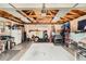 Spacious garage with exposed rafters and plenty of room for storage and projects at 7060 Avrum Dr, Denver, CO 80221