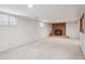 Spacious finished basement with brick fireplace at 3335 S Verbena Ct, Denver, CO 80231