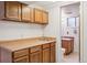 Finished basement area features a small bar area with access to a half bathroom at 3335 S Verbena Ct, Denver, CO 80231