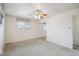 Bedroom with carpet, ceiling fan, and closet with mirror doors at 3335 S Verbena Ct, Denver, CO 80231