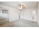 Bedroom featuring a ceiling fan and access to the bathroom at 3335 S Verbena Ct, Denver, CO 80231