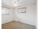 Bright bedroom featuring two windows and a ceiling fan with light at 3335 S Verbena Ct, Denver, CO 80231