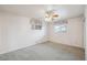 Bedroom with neutral walls, carpet, and windows at 3335 S Verbena Ct, Denver, CO 80231
