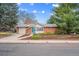 Charming brick home with a well-manicured front yard and mature trees at 3335 S Verbena Ct, Denver, CO 80231