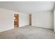 Spacious living room featuring neutral paint and carpet at 3335 S Verbena Ct, Denver, CO 80231