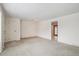 Spacious living room featuring neutral paint and carpet at 3335 S Verbena Ct, Denver, CO 80231