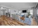 Bright living room with fireplace, hardwood floors and stairs leading to another level at 10624 Ladera Pt, Lone Tree, CO 80124