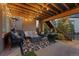 Covered patio with seating, rug, and outdoor staircase at 10624 Ladera Pt, Lone Tree, CO 80124