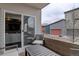 Balcony with a table and chairs next to the sliding glass doors at 1316 Snowberry Ln # 101, Louisville, CO 80027