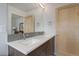 Bathroom with double sinks, vanity, and decorative mirror at 1316 Snowberry Ln # 101, Louisville, CO 80027
