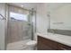 Modern bathroom with tiled shower, glass door, and a sleek vanity with a quartz countertop at 1316 Snowberry Ln # 101, Louisville, CO 80027