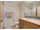 Bathroom features a shower-tub combination, single sink vanity, and a mirrored backsplash at 1316 Snowberry Ln # 101, Louisville, CO 80027