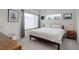 Calm bedroom with a large window, comfortable bed, and minimalist decor at 1316 Snowberry Ln # 101, Louisville, CO 80027