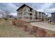 Modern apartment complex with well-maintained landscaping and an inviting entrance at 1316 Snowberry Ln # 101, Louisville, CO 80027
