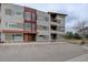 Apartment building featuring modern architecture and ample parking spaces at 1316 Snowberry Ln # 101, Louisville, CO 80027