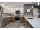 Well-appointed kitchen includes modern appliances, ample counter space, and stylish design at 1316 Snowberry Ln # 101, Louisville, CO 80027