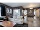 Inviting living room features contemporary decor, comfortable seating, and access to a patio at 1316 Snowberry Ln # 101, Louisville, CO 80027