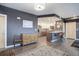 Bright open-concept features a living area connected to a modern kitchen and dining space at 1316 Snowberry Ln # 101, Louisville, CO 80027