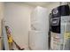 Utility room with stacked washer and dryer and water heater at 1316 Snowberry Ln # 101, Louisville, CO 80027
