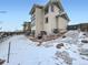 Backyard view showcases landscaping, steps to the upper level and hot tub at 938 Larkspur Ln, Louisville, CO 80027