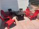 Outdoor patio area with red Adirondack chairs and a fire pit for relaxing evenings at 938 Larkspur Ln, Louisville, CO 80027