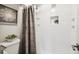 Bright shower stall with modern fixtures and decorative accent tile, perfect for a refreshing experience at 1390 N Emerson St # 106, Denver, CO 80218