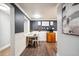 Cozy dining area featuring a small table and stylish decor with view into the kitchen at 1390 N Emerson St # 106, Denver, CO 80218