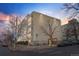 Exterior view of a multi-story building featuring modern architecture and well-maintained landscaping at 1390 N Emerson St # 106, Denver, CO 80218